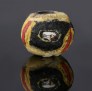 Ancient mosaic glass bead with face pattern